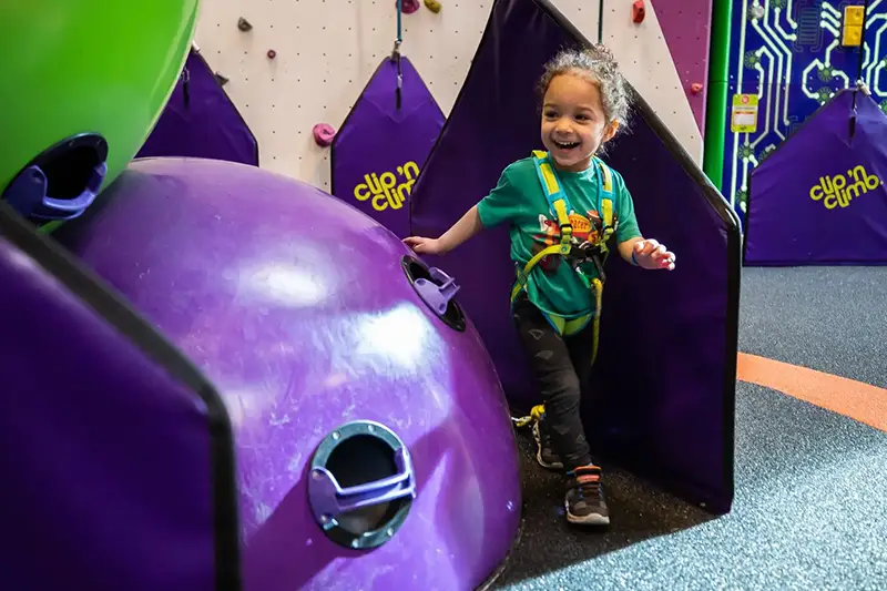 Toddler at indoor climbing centre