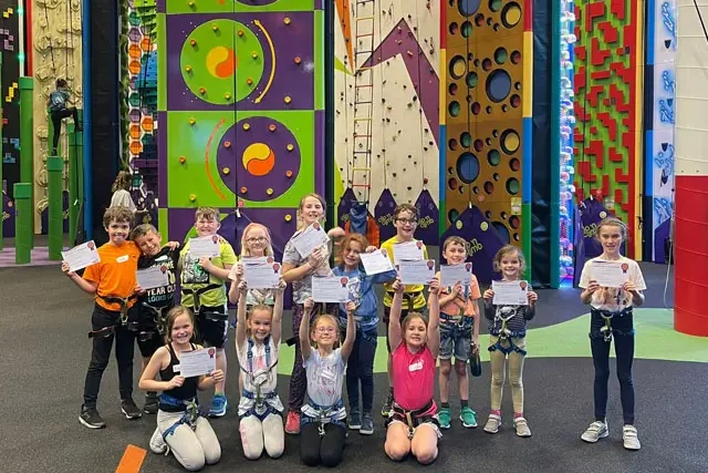Group of children at indoor climbing centre